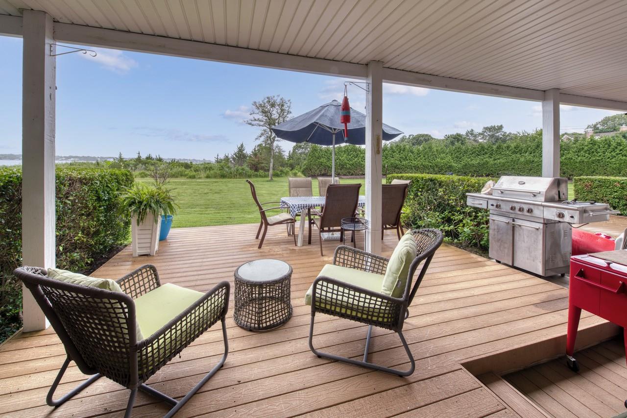 a view of a patio with couches chairs dining table and chairs