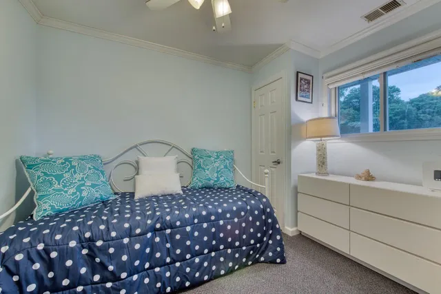 a bedroom with a large bed and a large window