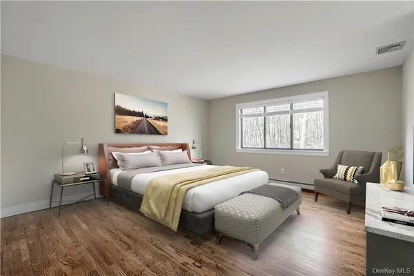 a bedroom with a bed and a couch