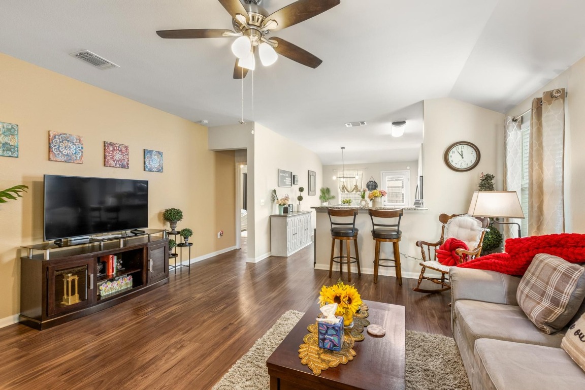 172 Alpha Kyle, TX 78640 - Photo 4 of 21 a living room with furniture and a flat screen tv with wooden floor