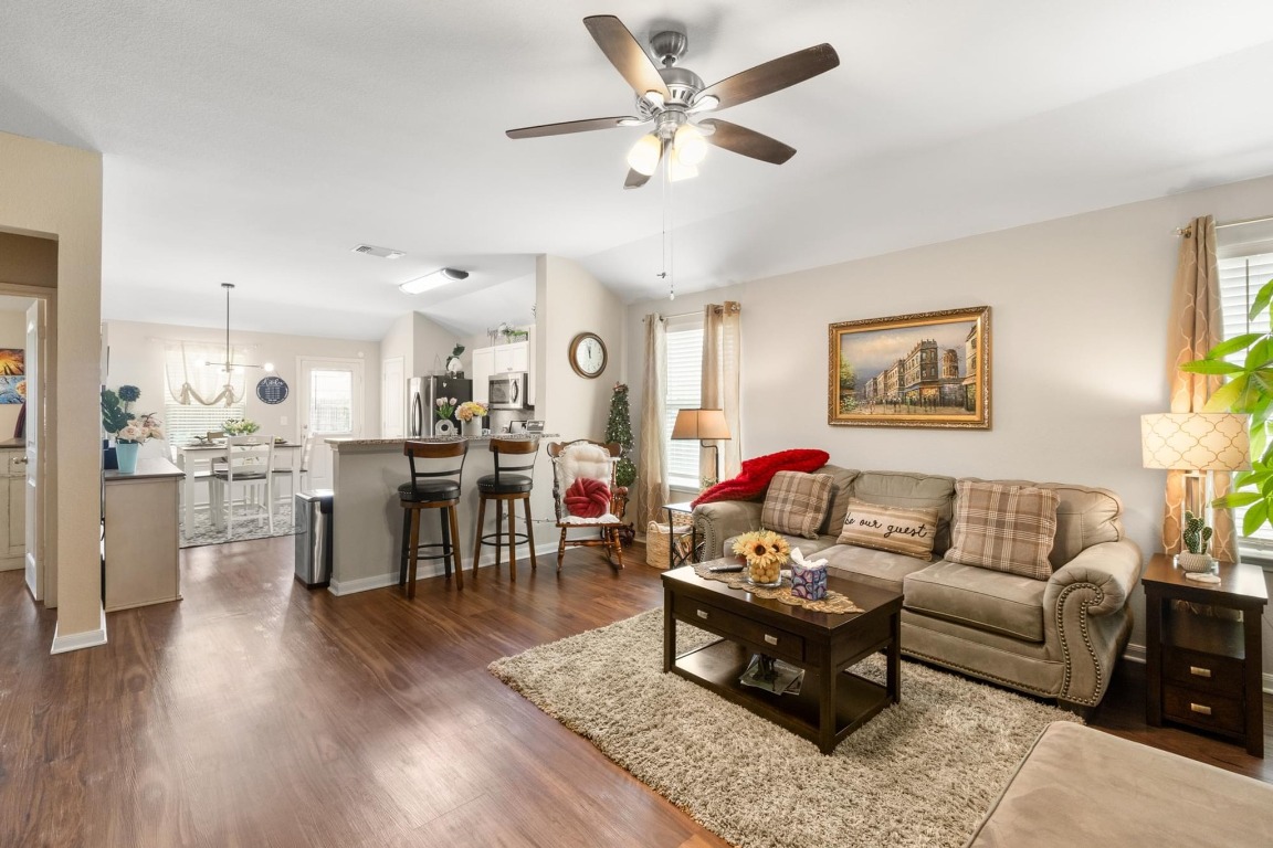 172 Alpha Kyle, TX 78640 - Photo 6 of 21 a living room with furniture kitchen view and a wooden floor
