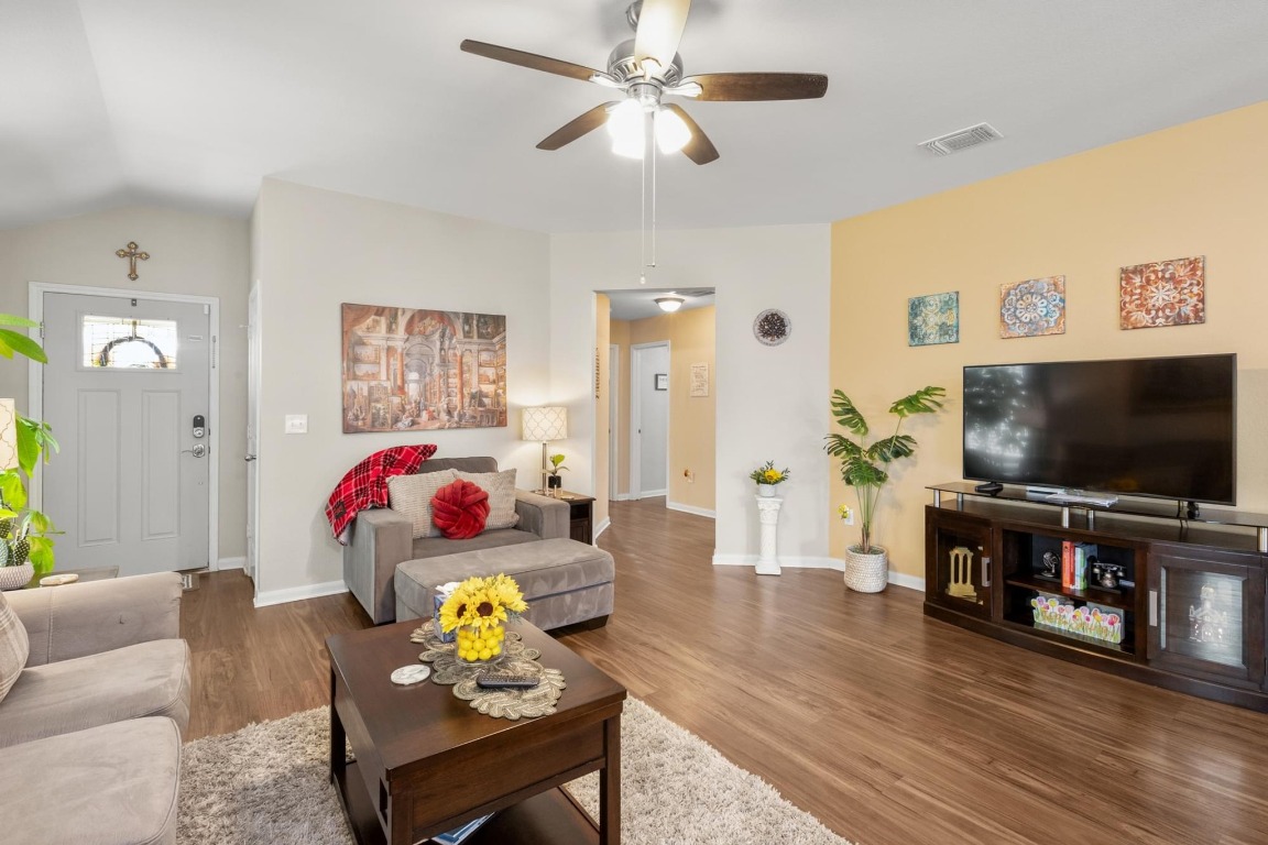 172 Alpha Kyle, TX 78640 - Photo 7 of 21 a living room with furniture and a flat screen tv