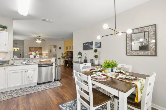 a kitchen with a table and chairs in it