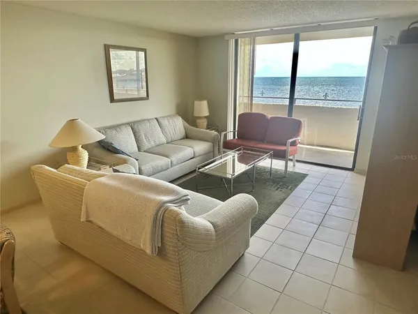a room with furniture and a flat screen tv