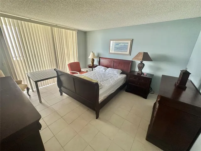 a spacious bathroom with double vanity and a mirror