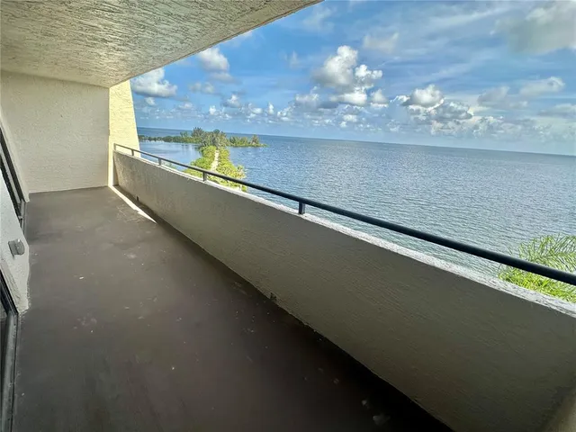 a view of a lake from a balcony