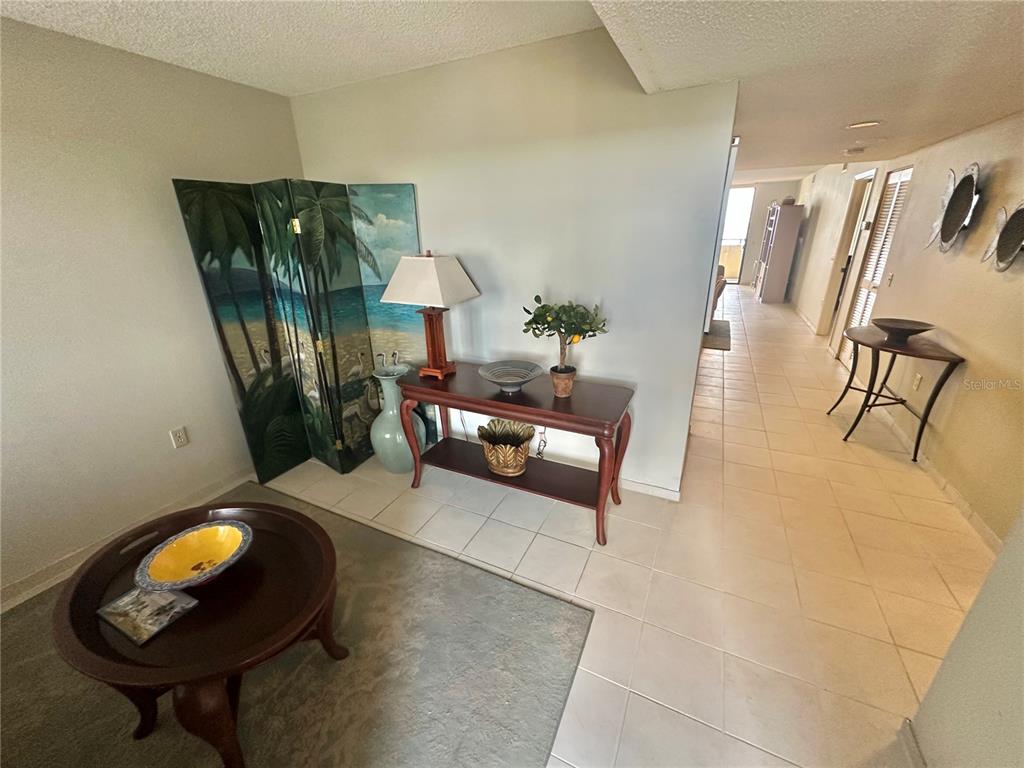 6035 Sea Ranch Drive, Unit 508 Hudson, FL 34667 - Photo 3 of 69 a living room with furniture and a rug