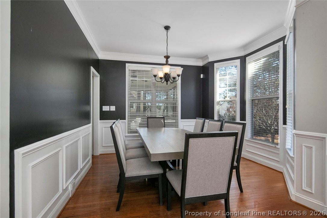 98 Cottswold Lane Spring Lake, NC 28390 - Photo 14 of 30 a view of a dining room with furniture window and wooden floor