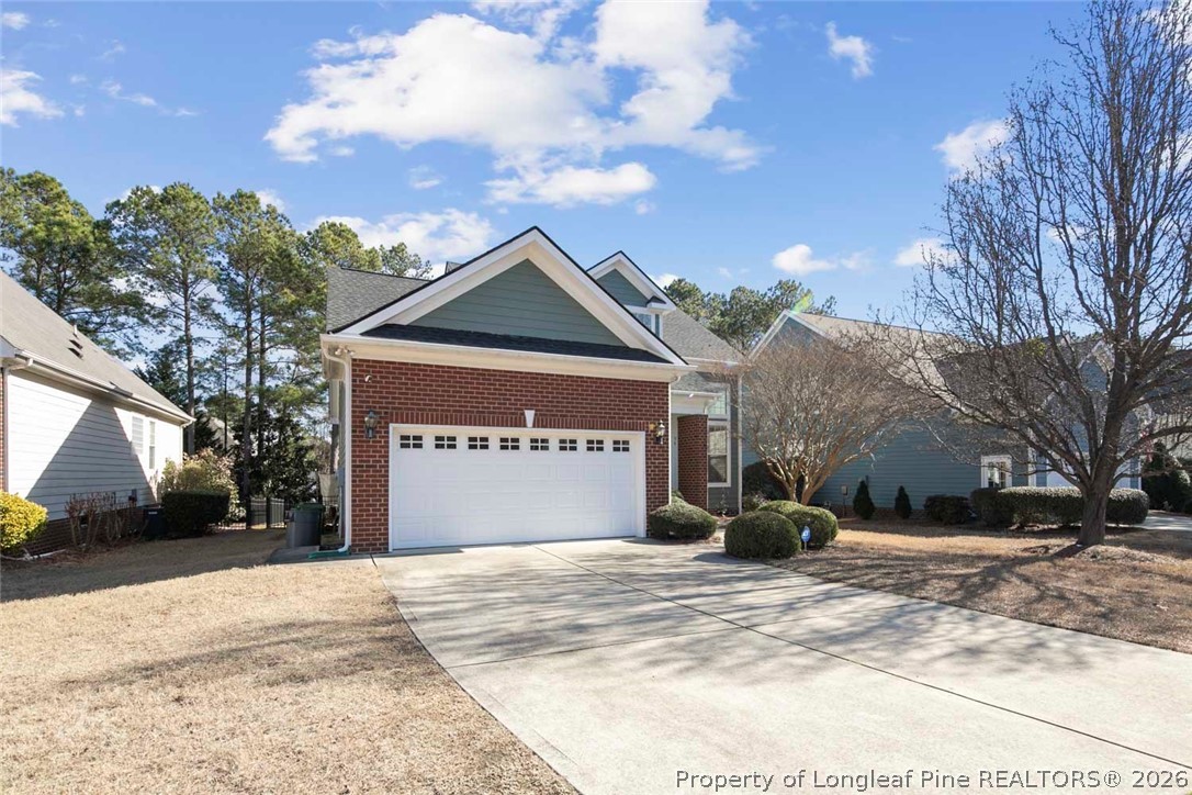 98 Cottswold Lane Spring Lake, NC 28390 - Photo 2 of 30 a front view of a house with a yard