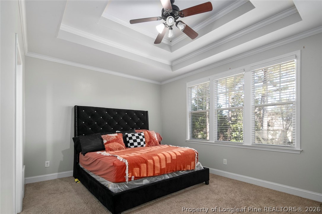 98 Cottswold Lane Spring Lake, NC 28390 - Photo 22 of 30 a bed sitting in a bedroom next to a window