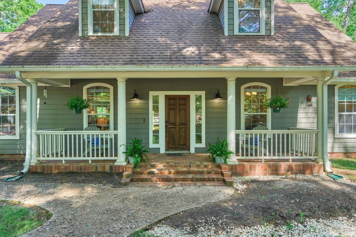 28694 West Fm 1097 Road Montgomery, TX 77356 - Photo 12 of 50 The front porch is a great place to sit, listen to birds sing, enjoy the breeze, and appreciate nature!