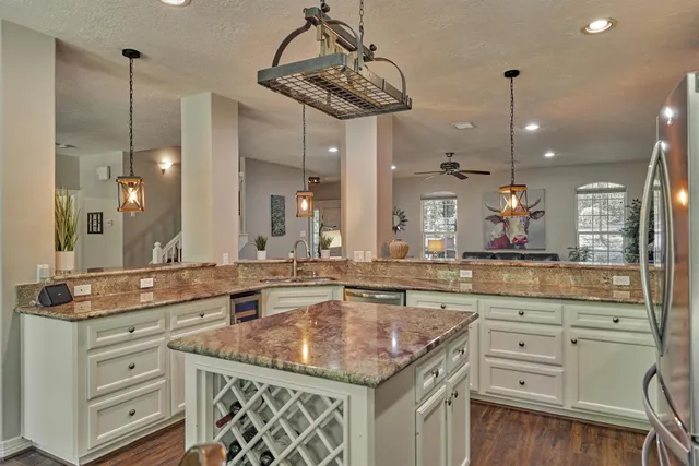 a kitchen with sink refrigerator and window