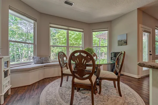 a open kitchen with stainless steel appliances granite countertop a stove and a sink
