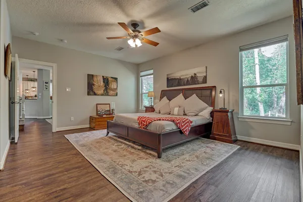 a dining room with furniture a rug and wooden floor