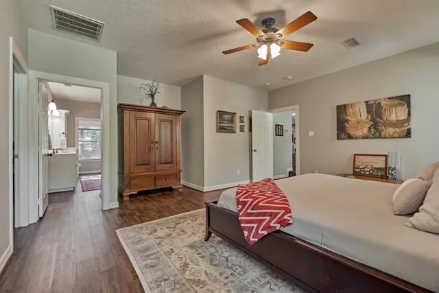 a spacious bedroom with a bed and window