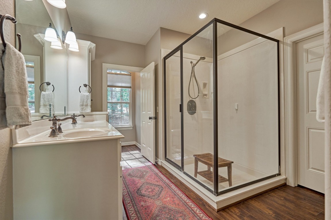 28694 West Fm 1097 Road Montgomery, TX 77356 - Photo 31 of 50 The primary bath has dual sinks, a private water closet, and large shower.