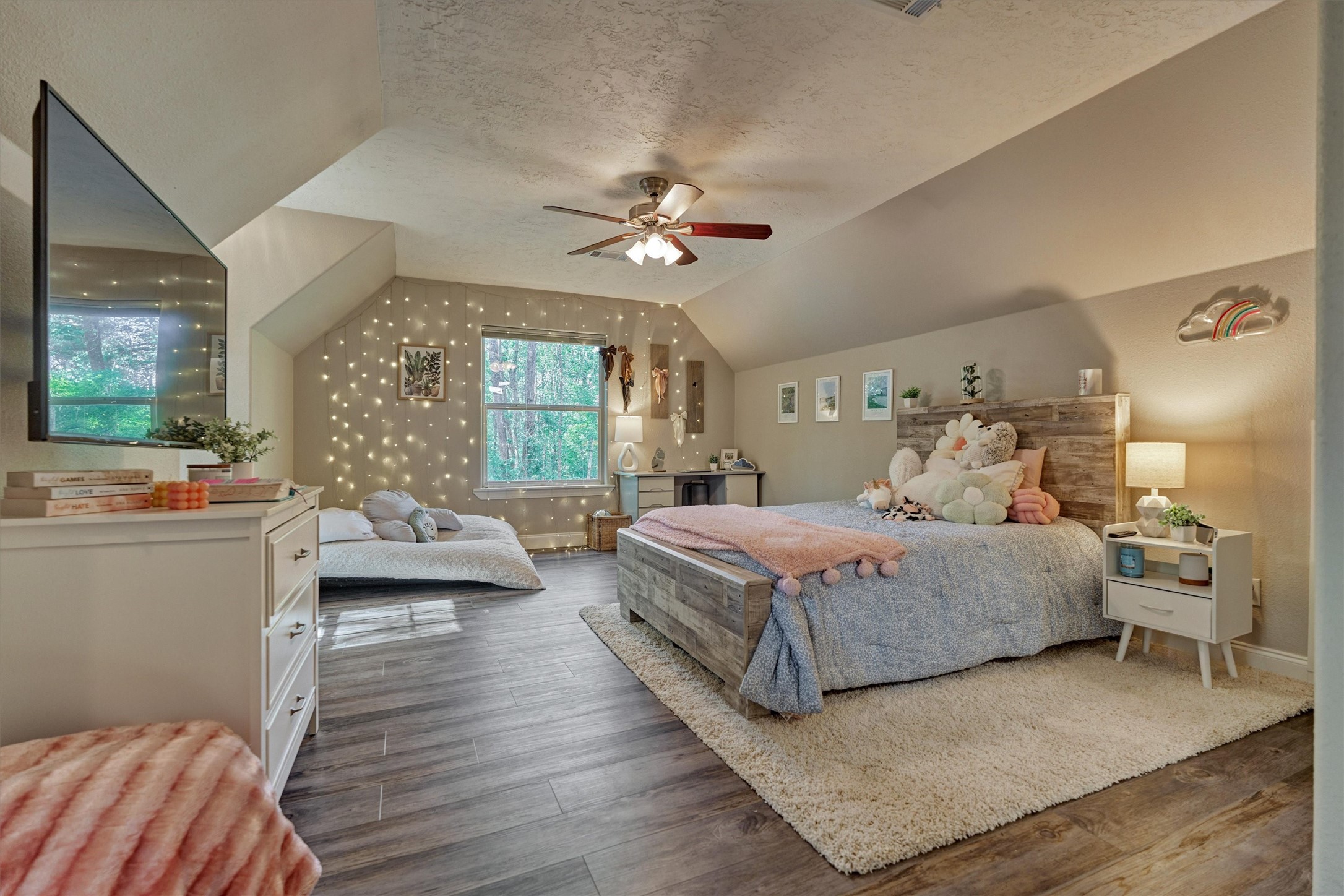 28694 West Fm 1097 Road Montgomery, TX 77356 - Photo 41 of 50 a bedroom with a large bed and wooden floor