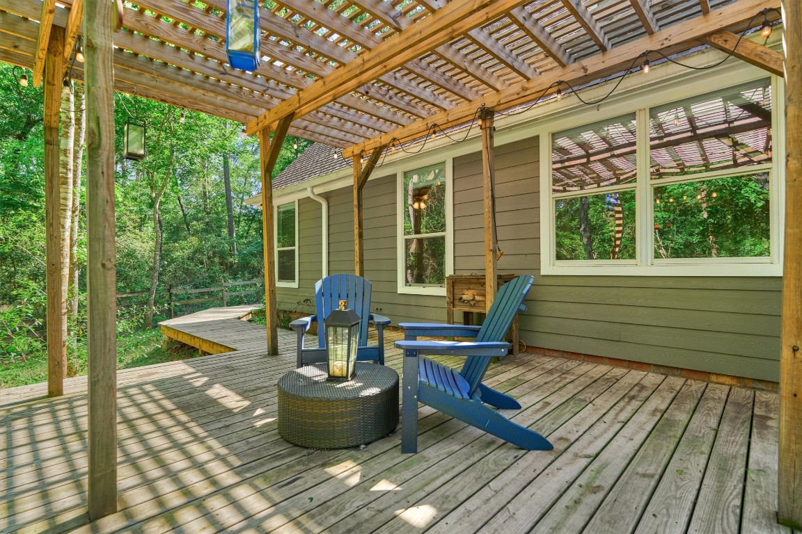 28694 West Fm 1097 Road Montgomery, TX 77356 - Photo 46 of 50 Sitting under the pergola is a great spot to enjoy views of the pool!
