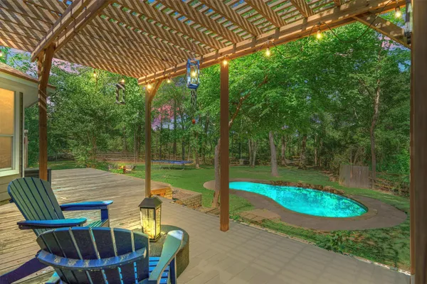 a view of a chair and tables in the patio
