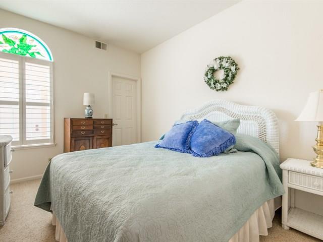 1298 Cuernavaca Circulo Mountain View, CA 94040 - Photo 7 of 11 a large bed sitting in a bedroom next to a window