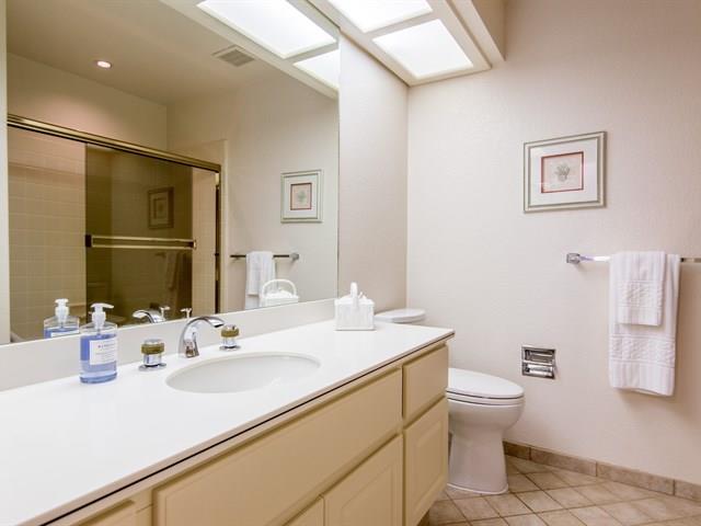 1298 Cuernavaca Circulo Mountain View, CA 94040 - Photo 8 of 11 a bathroom with a sink toilet and mirror