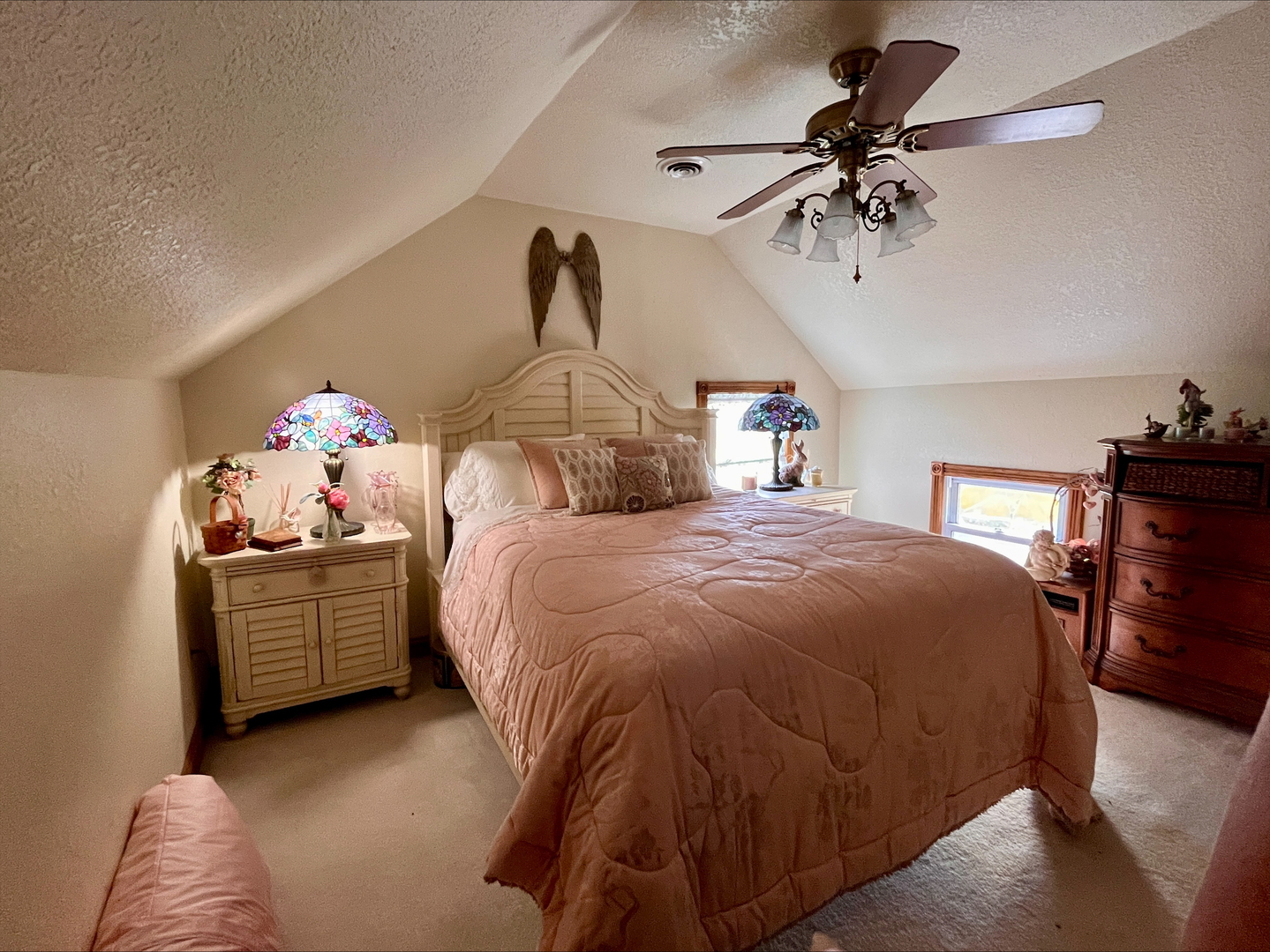 1116 East 2300 North Road Danforth, IL 60930 - Photo 12 of 32 a spacious bedroom with a bed and a chandelier