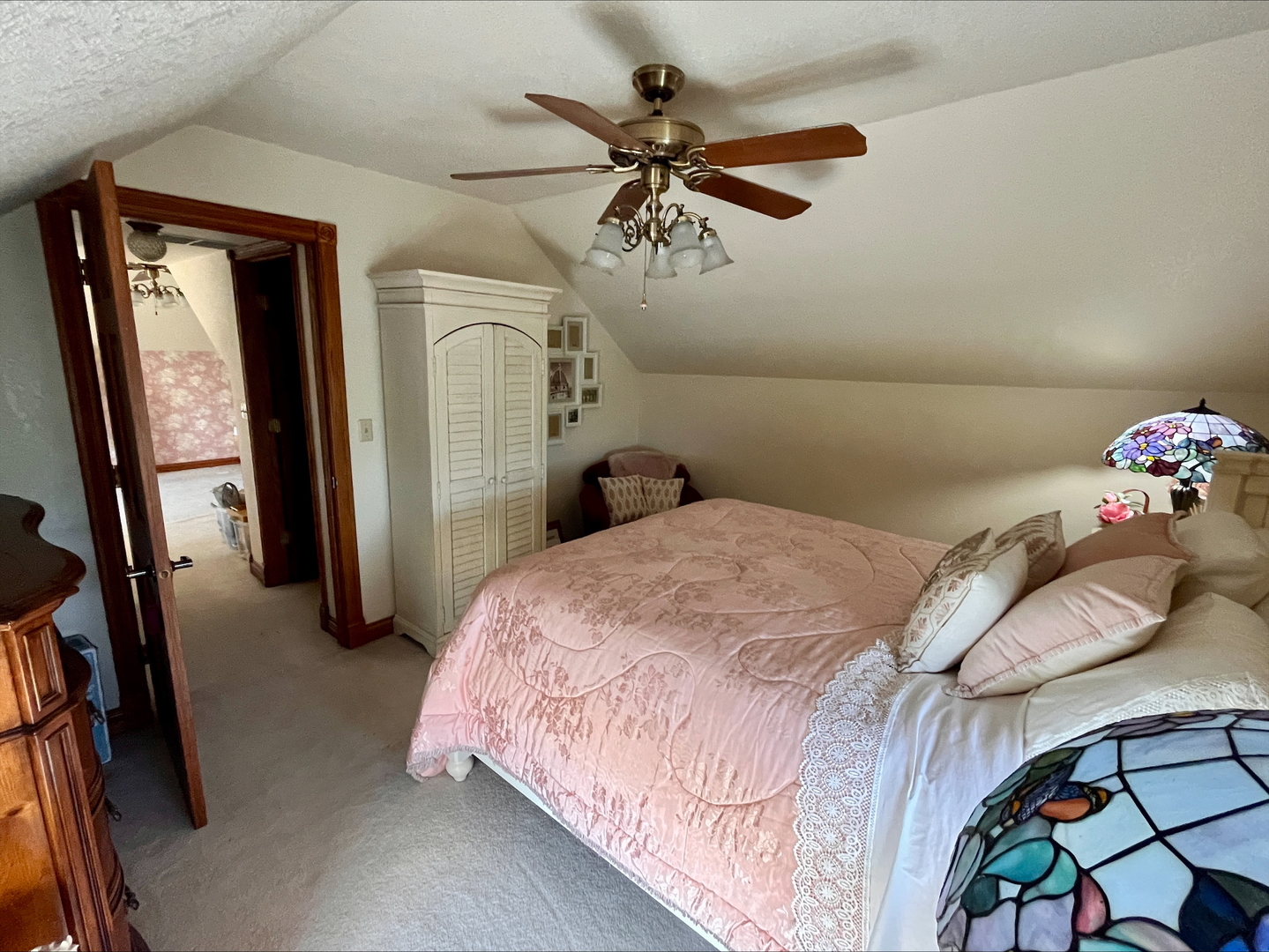1116 East 2300 North Road Danforth, IL 60930 - Photo 13 of 32 a bedroom with a bed and a chandelier