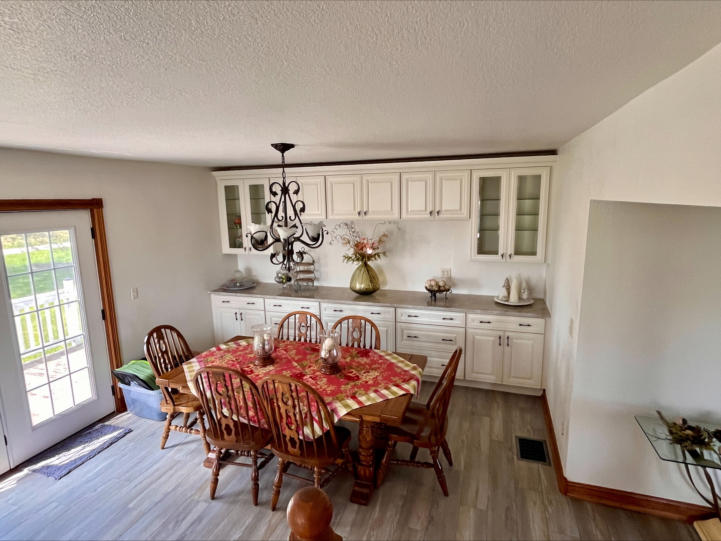1116 East 2300 North Road Danforth, IL 60930 - Photo 27 of 32 a view of a dining room with furniture and wooden floor