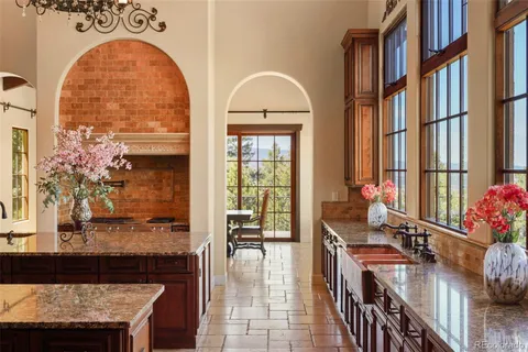 a living room filled with furniture and a floor to ceiling window