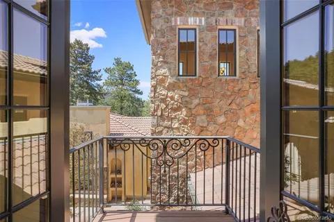 a view of a brick wall with a glass door