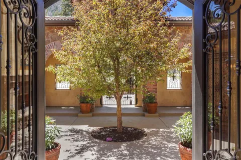 a view of a pathway of a house with a tree