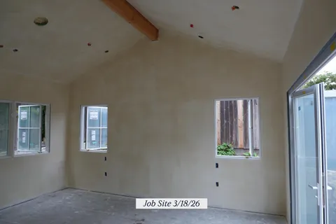 a view of a living room with windows