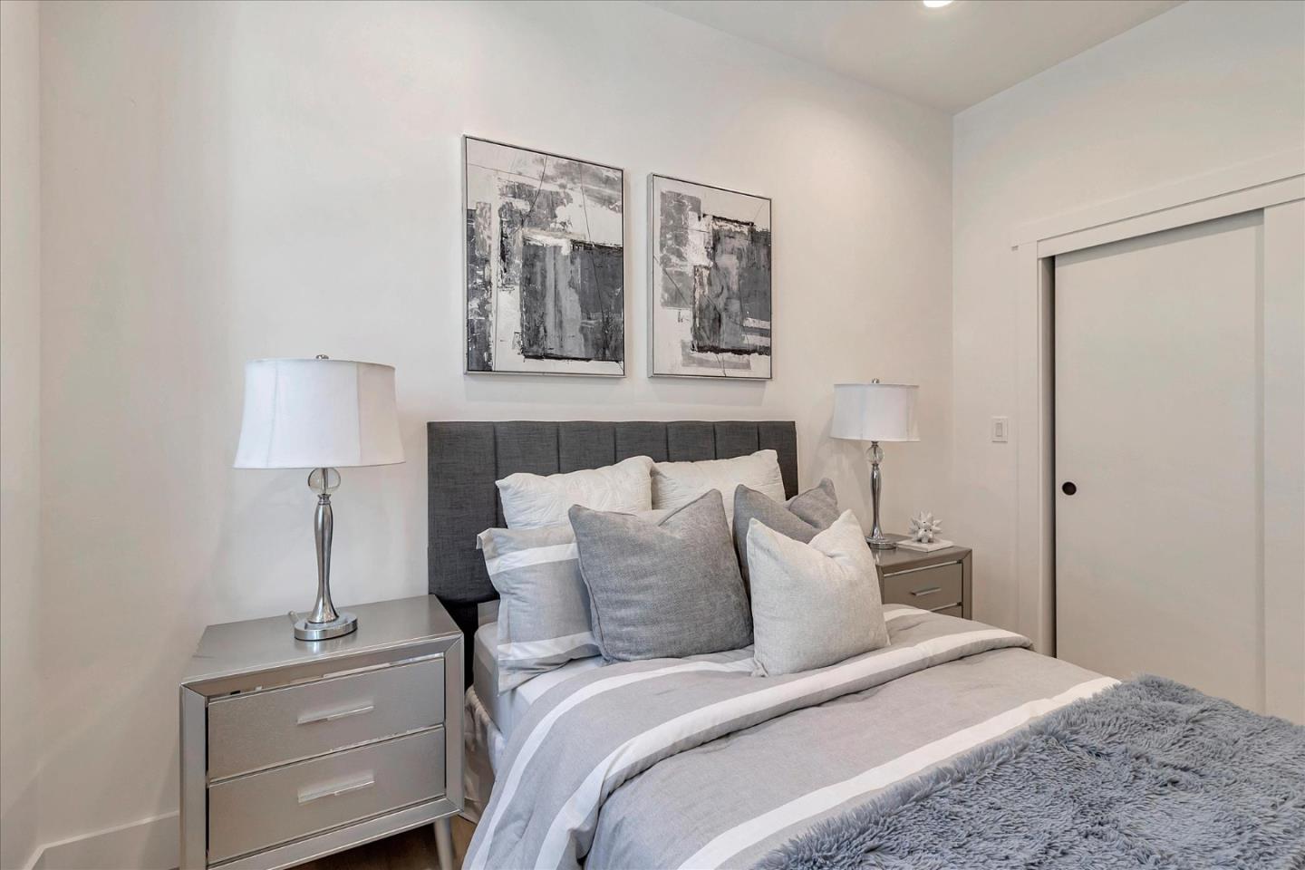 1982 Montecito Avenue Mountain View, CA 94043 - Photo 15 of 30 a bedroom with a bed and a lamp on table