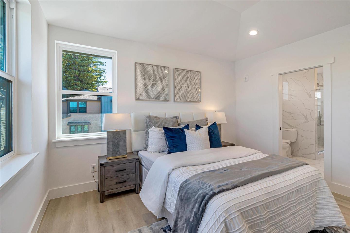 1982 Montecito Avenue Mountain View, CA 94043 - Photo 16 of 30 a bedroom with a bed and a large window