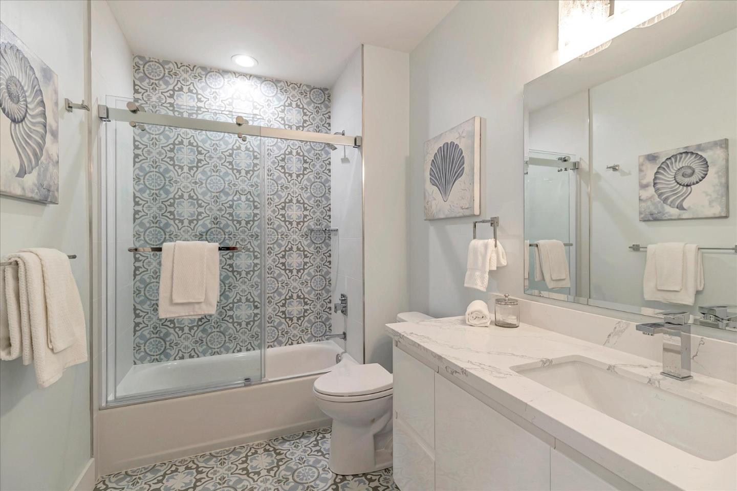 1982 Montecito Avenue Mountain View, CA 94043 - Photo 25 of 30 a bathroom with a granite countertop sink toilet and shower