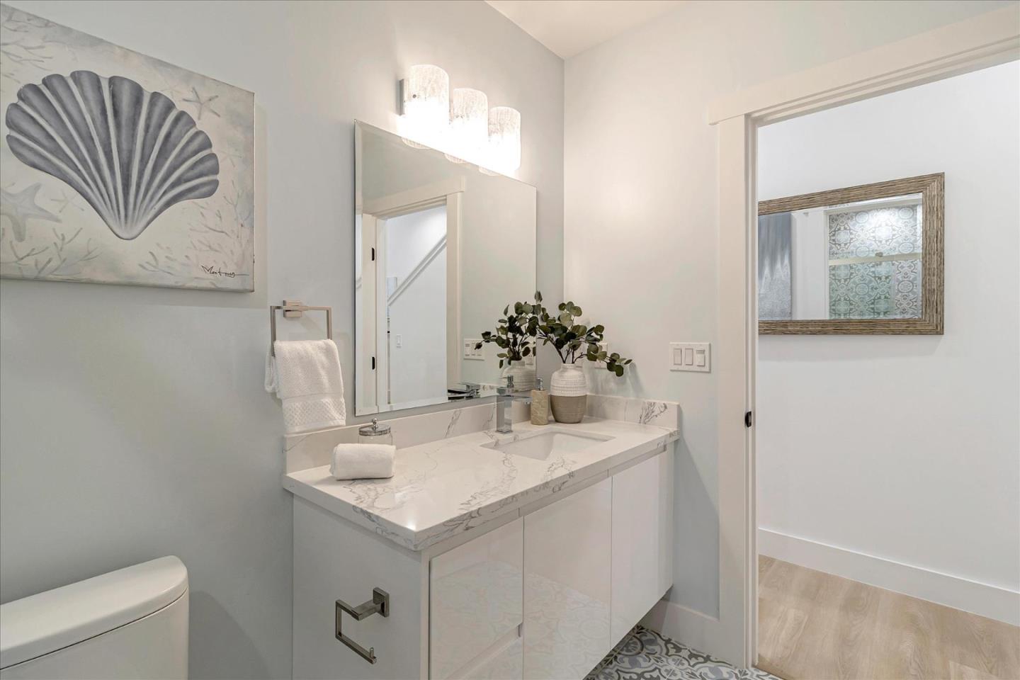 1982 Montecito Avenue Mountain View, CA 94043 - Photo 26 of 30 a bathroom with a sink vanity and a mirror