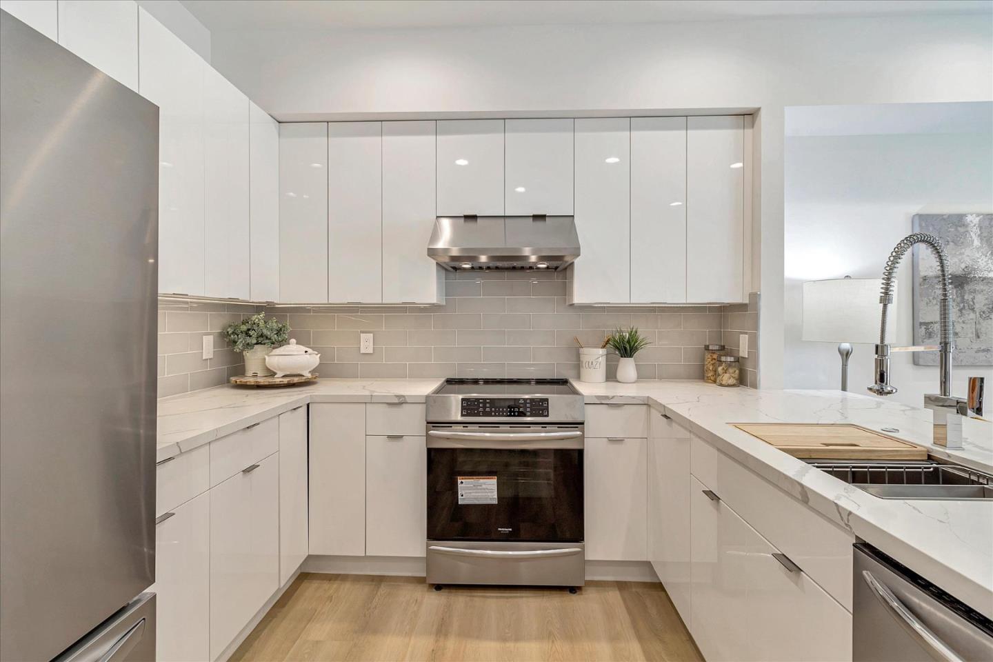 1982 Montecito Avenue Mountain View, CA 94043 - Photo 8 of 30 a kitchen with cabinets appliances and a sink