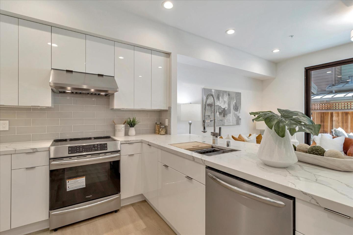 1982 Montecito Avenue Mountain View, CA 94043 - Photo 9 of 30 a kitchen with a sink stove and cabinets