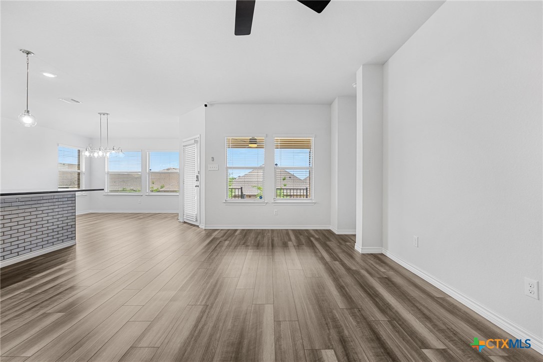 6166 Lavaca Drive Belton, TX 76513 - Photo 11 of 41 an empty room with wooden floor and windows