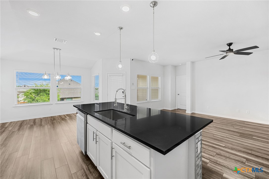 6166 Lavaca Drive Belton, TX 76513 - Photo 17 of 41 a kitchen with granite countertop a sink a counter top space and stainless steel appliances