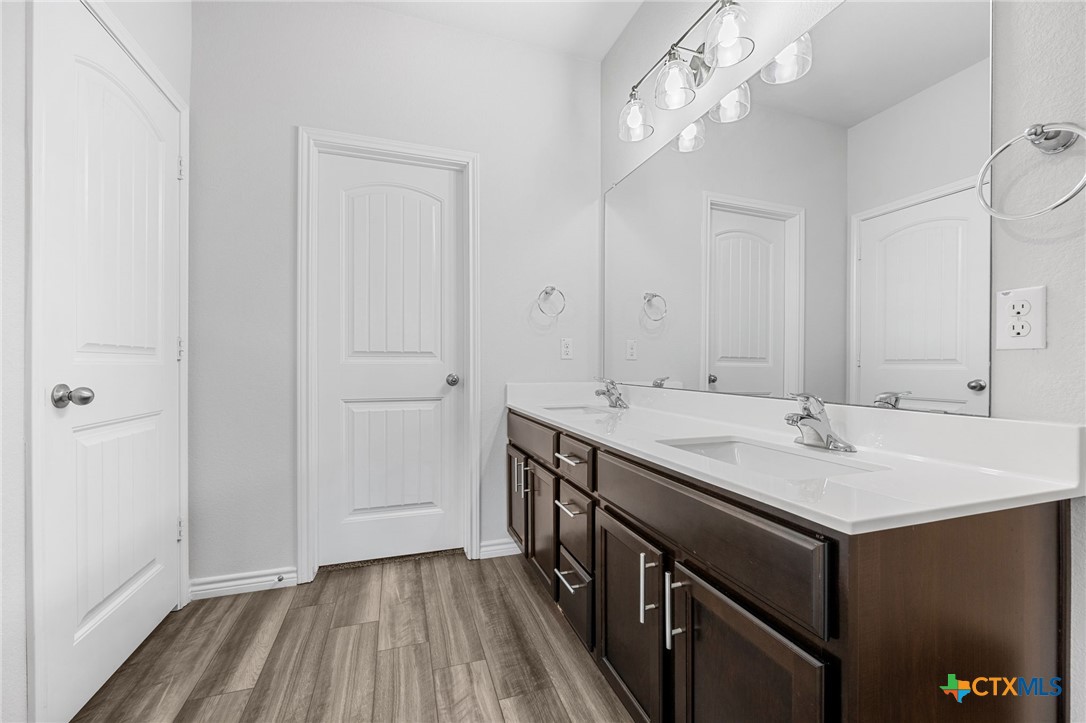 6166 Lavaca Drive Belton, TX 76513 - Photo 23 of 41 a bathroom with a sink a vanity and a mirror