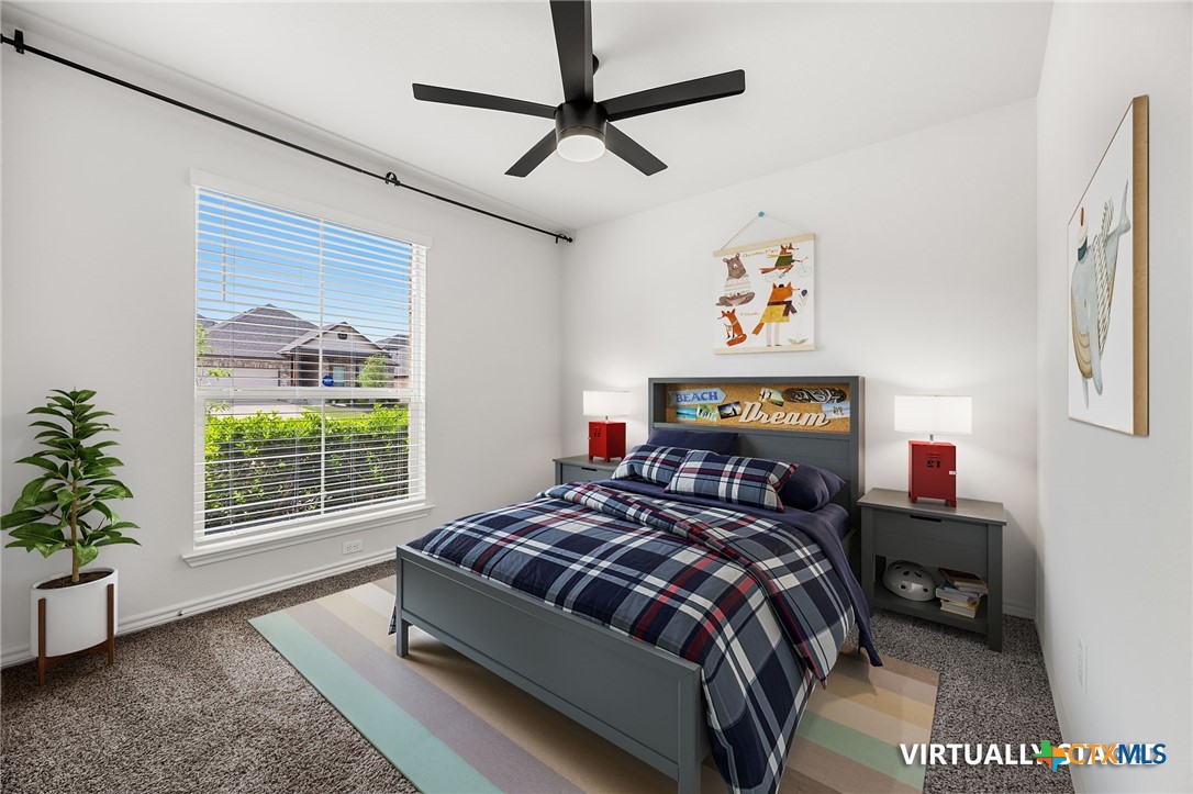 6166 Lavaca Drive Belton, TX 76513 - Photo 25 of 41 a bedroom with a bed a dresser next to a window