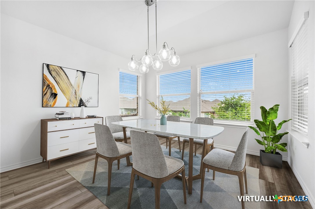 6166 Lavaca Drive Belton, TX 76513 - Photo 3 of 41 a view of a dining room with furniture and a chandelier