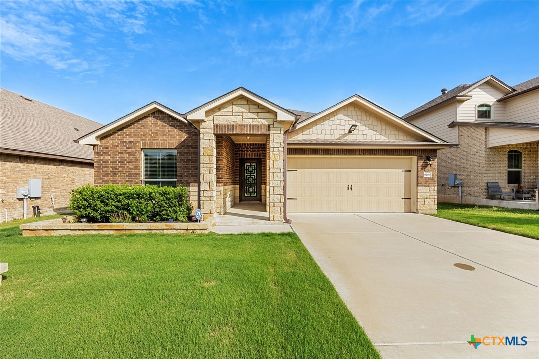 6166 Lavaca Drive Belton, TX 76513 - Photo 40 of 41 a front view of a house with a yard and garage