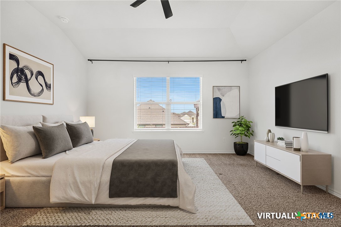 6166 Lavaca Drive Belton, TX 76513 - Photo 4 of 41 a bedroom with a large bed and a flat screen tv