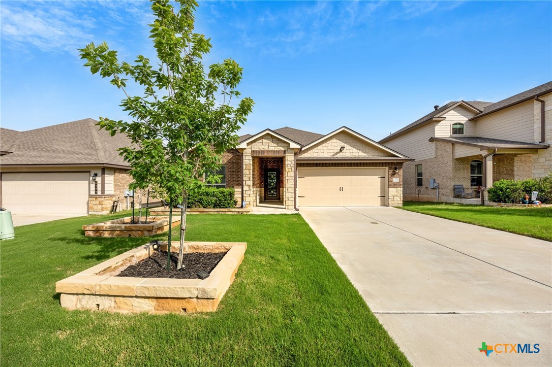6166 Lavaca Drive Belton, TX 76513 - Photo 41 of 41 a front view of a house with a yard and garage
