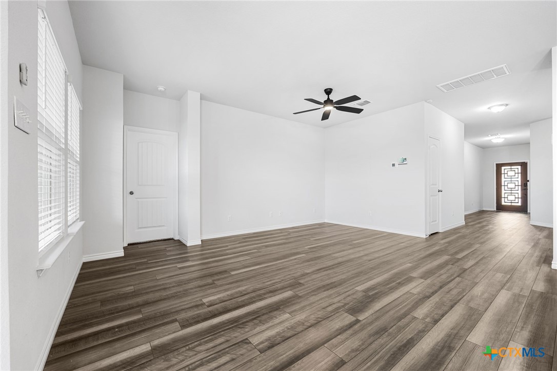 6166 Lavaca Drive Belton, TX 76513 - Photo 9 of 41 wooden floor in an empty room with a window