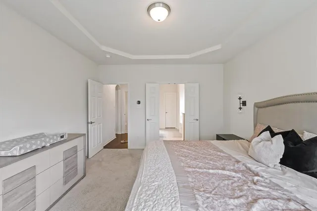 a bedroom with a bed and a stove