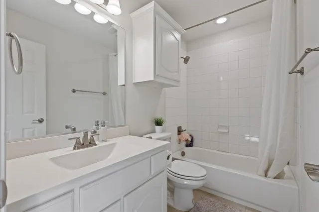 a bedroom with a bed and large window