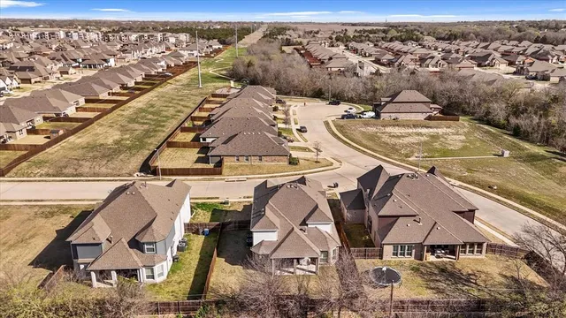 an aerial view of a house with a garden